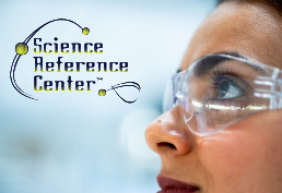 Woman with safety glasses on  captioned Science Reference Center